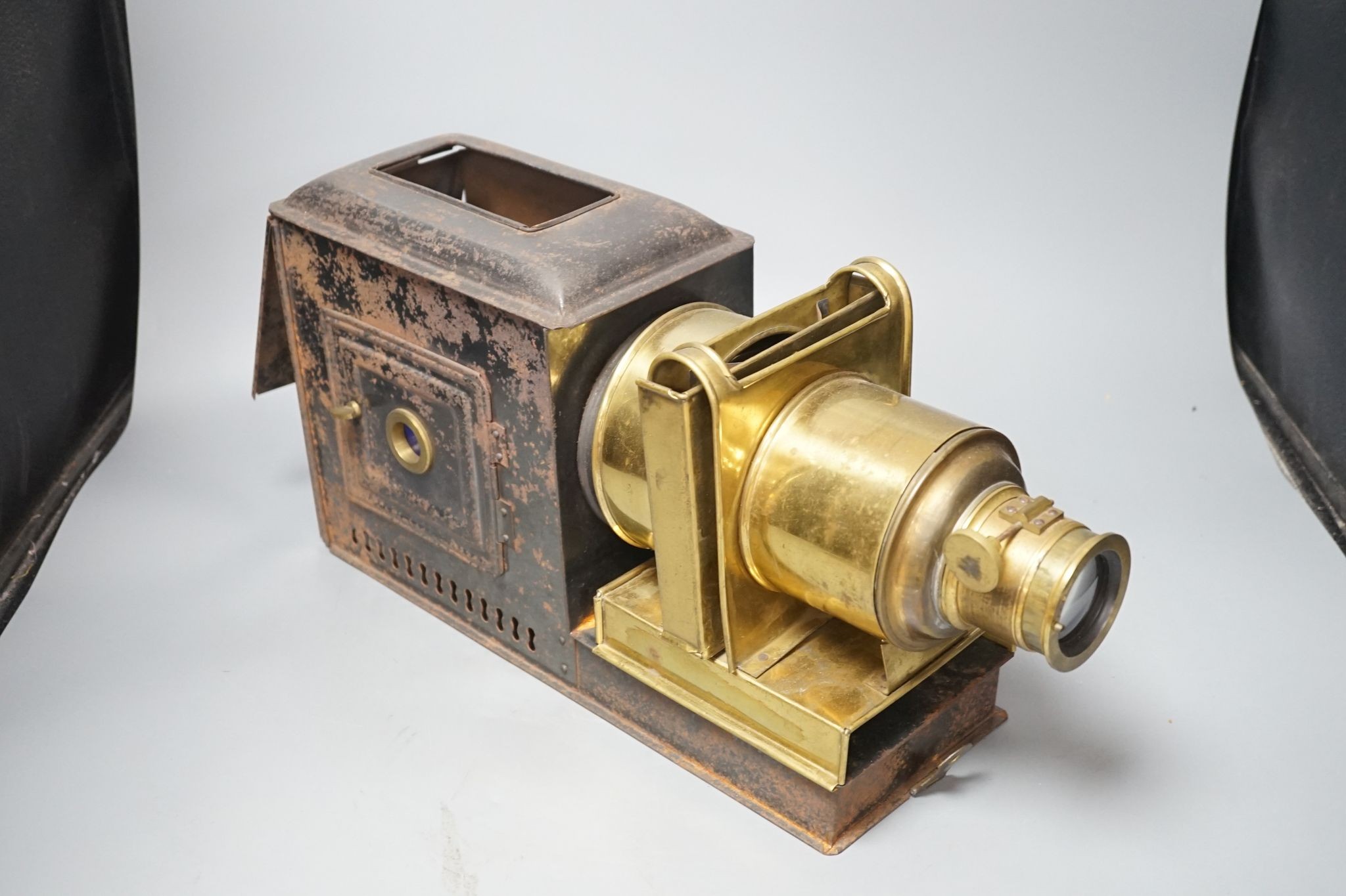 A cased tinplate and pressed brass Magic Lantern, Case 46 cm long